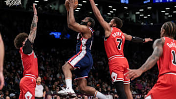 Dec 4, 2021; Brooklyn, New York, USA; Brooklyn Nets guard James Harden (13) drives to the basket as Chicago Bulls guard Lonzo Ball (2) and forward Troy Brown Jr. (7) defend during the second half at Barclays Center. Mandatory Credit: Vincent Carchietta-USA TODAY Sports