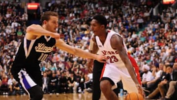Oct 5, 2014; Vancouver, British Columbia, CAN; Toronto Raptors guard Louis Williams (23) drives past Sacramento Kings guard Nik Stauskas (10) during the second half at Rogers Arena. The Toronto Raptors won 99-94. Mandatory Credit: Anne-Marie Sorvin-USA TODAY Sports
