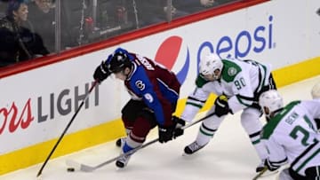 Feb 4, 2016; Denver, CO, USA; Colorado Avalanche center Matt Duchene (9) and Dallas Stars center Jason Spezza (90) battle for control of the puck in the first half at the Pepsi Center. Mandatory Credit: Ron Chenoy-USA TODAY Sports