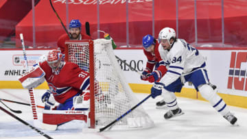 MONTREAL, QC - MAY 29: Auston Matthews #34 of the Toronto Maple Leafs attempts a shot against goaltender Carey Price #31 of the Montreal Canadiens during the first period in Game Six of the First Round of the 2021 Stanley Cup Playoffs at the Bell Centre on May 29, 2021 in Montreal, Canada. The Montreal Canadiens are the first NHL Canadian team to allow a reduced capacity of 2,500 fans inside their venue. (Photo by Minas Panagiotakis/Getty Images)