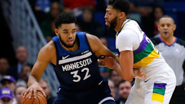 NEW ORLEANS, LOUISIANA - FEBRUARY 08: Karl-Anthony Towns #32 of the Minnesota Timberwolves drives against Anthony Davis #23 of the New Orleans Pelicans during the first half at the Smoothie King Center on February 08, 2019 in New Orleans, Louisiana. NOTE TO USER: User expressly acknowledges and agrees that, by downloading and or using this photograph, User is consenting to the terms and conditions of the Getty Images License Agreement. (Photo by Jonathan Bachman/Getty Images)