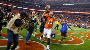 Sep 8, 2016; Denver, CO, USA; Denver Broncos quarterback Trevor Siemian (13) celebrates following the game against the Carolina Panthers at Sports Authority Field at Mile High. The Broncos defeated the Panthers 21-20. Mandatory Credit: Mark J. Rebilas-USA TODAY Sports