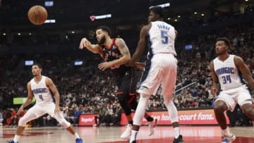 TORONTO, ON - OCTOBER 29: Fred VanVleet #23 of the Toronto Raptors gets a pass off as Mo Bamba #5 of the Orlando Magic defends (Photo by Cole Burston/Getty Images)