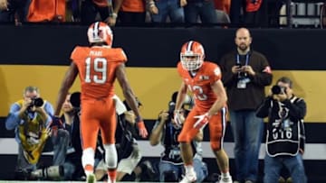 Jan 11, 2016; Glendale, AZ, USA; Clemson Tigers wide receiver Hunter Renfrow (13) celebrates with wide receiver Charone Peake (19) after scoring a touchdown against the Alabama Crimson Tide in the first quarter in the 2016 CFP National Championship at University of Phoenix Stadium. Mandatory Credit: Matt Kartozian-USA TODAY Sports