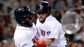 Oct 19, 2013; Boston, MA, USA; Boston Red Sox right fielder Shane Victorino (right) celebrates with designated hitter David Ortiz (34) after hitting a grand slam against the Detroit Tigers during the seventh inning in game six of the American League Championship Series playoff baseball game at Fenway Park. Mandatory Credit: Robert Deutsch-USA TODAY Sports