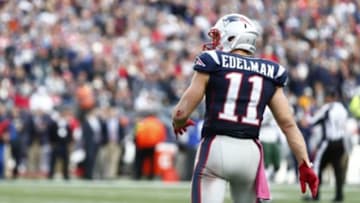 Oct 25, 2015; Foxborough, MA, USA; New England Patriots wide receiver Julian Edelman (11) speaks to New York Jets defensive back Buster Skrine (not pictured) during the second half at Gillette Stadium. Mandatory Credit: Mark L. Baer-USA TODAY Sports