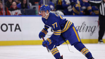 Dec 29, 2021; Buffalo, New York, USA; Buffalo Sabres right wing JJ Peterka (77) looks for the puck during the second period against the New Jersey Devils at KeyBank Center. Mandatory Credit: Timothy T. Ludwig-USA TODAY Sports