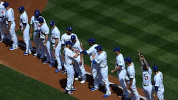 LOS ANGELES, CA - MARCH 28: Pitcher Clayton Kershaw #22 of the Los Angeles Dodgers is greeted by his teammates as they line up for an Opening Day game against Arizona Diamondbacks at Dodger Stadium on March 28, 2019 in Los Angeles, California. (Photo by Kevork Djansezian/Getty Images)