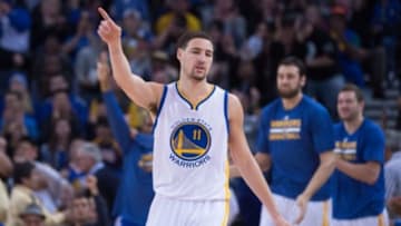 January 7, 2015; Oakland, CA, USA; Golden State Warriors guard Klay Thompson (11) celebrates after a basket during the third quarter against the Indiana Pacers at Oracle Arena. The Warriors defeated the Pacers 117-102. Mandatory Credit: Kyle Terada-USA TODAY Sports