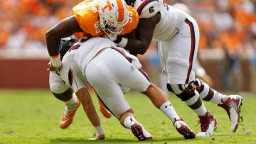 KNOXVILLE, TN - OCTOBER 14: Reginald McKenzie Jr. #99 of the Tennessee Volunteers sacks Jake Bentley #19 of the South Carolina Gamecocks during the first half at Neyland Stadium on October 14, 2017 in Knoxville, Tennessee. (Photo by Michael Reaves/Getty Images)