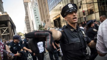 NEW YORK, NY - SEPTEMBER 5: New York City Police (NYPD) officers attempt to clear the street of immigration activists protesting the Trump administration's decision on the Deferred Action for Childhood Arrivals on 5th Avenue near Trump Tower, September 5, 2017. On Tuesday, the Trump administration announced they will end the Deferred Action for Childhood Arrivals program, with a six month delay. The decision represents a blow to young undocumented immigrants (also known as 'dreamers') who were shielded from deportation under DACA. (Photo by Drew Angerer/Getty Images)