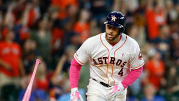 HOUSTON, TEXAS - MAY 12: George Springer #4 of the Houston Astros hits a two-run home run in the sixth inning against the Texas Rangers at Minute Maid Park on May 12, 2019 in Houston, Texas. (Photo by Bob Levey/Getty Images)