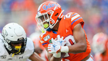 GAINESVILLE, FLORIDA - SEPTEMBER 28: Malik Davis #20 of the Florida Gators runs for yardage during the fourth quarter against the Towson Tigers at Ben Hill Griffin Stadium on September 28, 2019 in Gainesville, Florida. (Photo by James Gilbert/Getty Images)