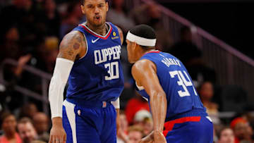 ATLANTA, GA - NOVEMBER 19: Mike Scott #30 of the LA Clippers reacts after hitting a three-point basket against the Atlanta Hawks with Tobias Harris #34 at State Farm Arena on November 19, 2018 in Atlanta, Georgia. NOTE TO USER: User expressly acknowledges and agrees that, by downloading and or using this photograph, User is consenting to the terms and conditions of the Getty Images License Agreement. (Photo by Kevin C. Cox/Getty Images)