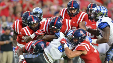 Oct 1, 2016; Oxford, MS, USA; Memphis Tigers wide receiver Anthony Miller (3) is tackled by multiple members of the Mississippi Rebels defense during the first quarter of the game at Vaught-Hemingway Stadium. Mandatory Credit: Matt Bush-USA TODAY Sports