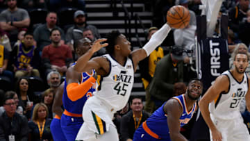 SALT LAKE CITY, UT - DECEMBER 29: Donovan Mitchell #45 of the Utah Jazz grabs a rebound in the first half of a NBA game against the New York Knicks at Vivint Smart Home Arena on December 29, 2018 in Salt Lake City, Utah. NOTE TO USER: User expressly acknowledges and agrees that, by downloading and or using this photograph, User is consenting to the terms and conditions of the Getty Images License Agreement. (Photo by Gene Sweeney Jr./Getty Images)