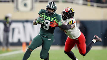 EAST LANSING, MICHIGAN - NOVEMBER 13: Kenneth Walker III #9 of the Michigan State Spartans runs up the field as Ahmad McCullough #19 of the Maryland Terrapins tries to chase him down in the first half at Spartan Stadium on November 13, 2021 in East Lansing, Michigan. (Photo by Mike Mulholland/Getty Images)