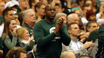 SYRACUSE, NY - MARCH 27: Former Basketball player Earvin 'Magic' Johnson claps in the second half of the game between the Michigan State Spartans and the Oklahoma Sooners during the East Regional Semifinal of the 2015 NCAA Men's Basketball Tournament at the Carrier Dome on March 27, 2015 in Syracuse, New York. (Photo by Elsa/Getty Images)