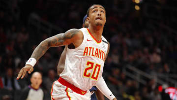 ATLANTA, GA - JANUARY 06: John Collins #20 of the Atlanta Hawks looks for the rebound during the first half of an NBA game against the Denver Nuggets at State Farm Arena on January 6, 2020 in Atlanta, Georgia. NOTE TO USER: User expressly acknowledges and agrees that, by downloading and/or using this photograph, user is consenting to the terms and conditions of the Getty Images License Agreement. (Photo by Todd Kirkland/Getty Images)