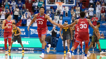 Feb 27, 2021; Lawrence, Kansas, USA; Kansas Jayhawks forward David McCormack (33) high fives Kansas Jayhawks guard Ochai Agbaji (30) after a play against the Baylor Bears in the second half at Allen Fieldhouse. Mandatory Credit: Amy Kontras-USA TODAY Sports