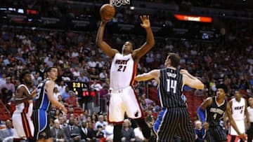 Mar 25, 2016; Miami, FL, USA; Miami Heat center Hassan Whiteside (21) dunks the ball over Orlando Magic forward Jason Smith (14) in the second half at American Airlines Arena. The Heat won 108-97. Mandatory Credit: Robert Mayer-USA TODAY Sports