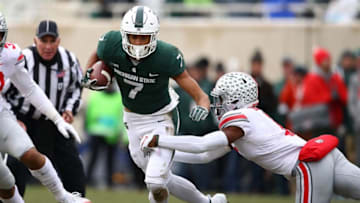 EAST LANSING, MI - NOVEMBER 10: Cody White #7 of the Michigan State Spartans tries to get around the tackle of Jeffrey Okudah #1 of the Ohio State Buckeyes after a first half catch at Spartan Stadium on November 10, 2018 in East Lansing, Michigan. (Photo by Gregory Shamus/Getty Images)