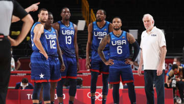SAITAMA, JAPAN - JULY 25: Zachary Lavine #5, Jrue Holiday #12, Bam Adebayo #13, Kevin Durant #7, Damian Lillard #6 and Head Coach Gregg Popovich of Team United States of America look on in disbelief during their game against France in Men's Preliminary Round Group B action on day two of the Tokyo 2020 Olympic Games at Saitama Super Arena on July 25, 2021 in Saitama, Japan. (Photo by Gregory Shamus/Getty Images)