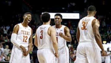 Feb 1, 2016; Waco, TX, USA; Texas Longhorns guard Kerwin Roach Jr. (12) and guard Javan Felix (3) and guard Isaiah Taylor (1) and forward Shaquille Cleare (32) react during the second half against the Baylor Bears at Ferrell Center. Mandatory Credit: Kevin Jairaj-USA TODAY Sports