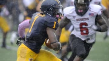Oct 5, 2013; Kent, OH, USA; Kent State Golden Flashes running back Dri Archer (1) runs against the defense of Northern Illinois Huskies linebacker Jamaal Bass (6) during the first quarter at Dix Stadium. Mandatory Credit: Ken Blaze-USA TODAY Sports