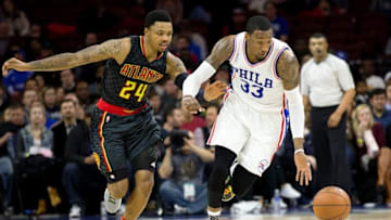 Feb 3, 2016; Philadelphia, PA, USA; Philadelphia 76ers forward Robert Covington (33) steals the ball from Atlanta Hawks forward Kent Bazemore (24) during the first half at Wells Fargo Center. Mandatory Credit: Bill Streicher-USA TODAY Sports