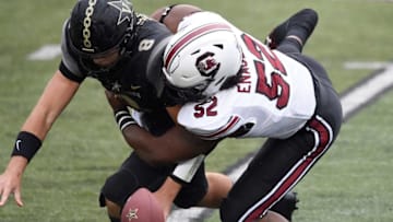 Vanderbilt quarterback Ken Seals (8) fumbles as he’s hit by South Carolina defensive lineman Kingsley Enagbare (52) during the first quarter at Vanderbilt Stadium Saturday, Oct. 10, 2020 in Nashville, Tenn.Gw42703
