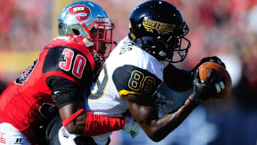 Dec 5, 2015; Bowling Green, KY, USA; Southern Miss Golden Eagles wide receiver Mike Thomas (88) catches the ball in front of Western Kentucky Hilltoppers defensive back Prince Charles Iworah (30) during the first half of the Conference USA football championship game at Houchens Industries-L.T. Smith Stadium. Mandatory Credit: Joshua Lindsey-USA TODAY Sports