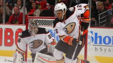 Oct 28, 2014; Chicago, IL, USA; Anaheim Ducks right wing Devante Smith-Pelly (12) clears the puck during the third period against the Chicago Blackhawks at the United Center. Anaheim won 1-0. Mandatory Credit: Dennis Wierzbicki-USA TODAY Sports