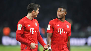 BERLIN, GERMANY - JANUARY 19: Robert Lewandowski of Bayern Munich reacts with David Alaba of Bayern Munich during the Bundesliga match between Hertha BSC and FC Bayern Muenchen at Olympiastadion on January 19, 2020 in Berlin, Germany. (Photo by PressFocus/MB Media/Getty Images)