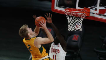 Nov 28, 2020; Lincoln, Nebraska, USA; North Dakota State Bison guard Jaxon Knotek (2) drives to the basket against Nebraska Cornhuskers forward Lat Mayen (11) in the second half at Pinnacle Bank Arena. Mandatory Credit: Bruce Thorson-USA TODAY Sports
