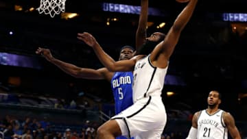 Nov 10, 2021; Orlando, Florida, USA; Brooklyn Nets guard James Harden (13) goes to the basket as Orlando Magic center Mo Bamba (5) defends during the first quarter at Amway Center. Mandatory Credit: Kim Klement-USA TODAY Sports