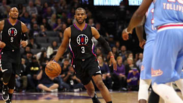 Jan 6, 2017; Sacramento, CA, USA; Los Angeles Clippers guard Chris Paul (3) dribbles down the court against Sacramento Kings guard Ty Lawson (10) during the second quarter at Golden 1 Center. Mandatory Credit: Sergio Estrada-USA TODAY Sports