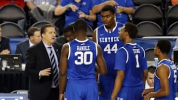 Apr 7, 2014; Arlington, TX, USA; Kentucky Wildcats head coach John Calipari talks to forward Julius Randle (30) and center Dakari Johnson (44) and guard/forward James Young (1) in the second half against the Connecticut Huskies during the championship game of the Final Four in the 2014 NCAA Mens Division I Championship tournament at AT&T Stadium. Mandatory Credit: Matthew Emmons-USA TODAY Sports
