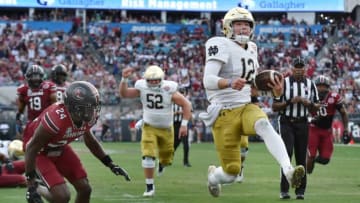 Notre Dame Fighting Irish quarterback Tyler Buchner (12) high steps it into the end zone for a late first quarter touchdown, The University of Notre Dame Fighting Irish took on the University of South Carolina Gamecocks in the TaxSlayer Gator Bowl game in Jacksonville, Florida's TIAA Bank Field Friday, December 30, 2022. The first half ended with South Carolina holding a 24 to 17 lead. [Bob Self/Florida Times-Union]Jki 123022 Bs Gatorbowl 04Syndication Florida Times UnionSyndication Notre Dame Insider