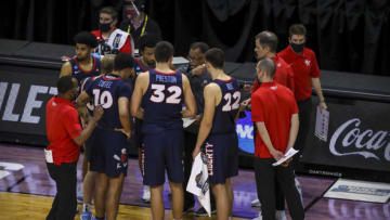 Mar 19, 2021; Indianapolis, IN, USA; Liberty Flames head coach Ritchie McKay talks with his team during a timeout in the game against the Oklahoma State Cowboys in the first round of the 2021 NCAA Tournament at Indiana Farmers Coliseum. Mandatory Credit: Katie Stratman-USA TODAY Sports
