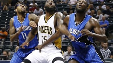 Oct 8, 2015; Indianapolis, IN, USA; Indiana Pacers forward Rakeem Christmas (25) battles for position with Orlando Magic center Nnanna Egwu (21) and forward Devyn Marble (11) at Bankers Life Fieldhouse. The Pacers won 97-92. Mandatory Credit: Brian Spurlock-USA TODAY Sports