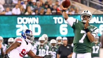 Aug 22, 2014; East Rutherford, NJ, USA; New York Jets quarterback Geno Smith (7) passes during the second quarter against the New York Giants at MetLife Stadium. Mandatory Credit: Anthony Gruppuso-USA TODAY Sports