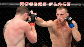 EDMONTON, ALBERTA - JULY 27: (R-L) Krzysztof Jotko of Poland punches Marc-Andre Barriault of Canada in their middleweight bout during the UFC 240 event at Rogers Place on July 27, 2019 in Edmonton, Alberta, Canada. (Photo by Jeff Bottari/Zuffa LLC/Zuffa LLC)