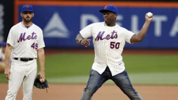 May 27, 2014; New York, NY, USA; New York Mets starting pitcher Jonathon Niese (49) looks on as recording artist 50 Cent throws out the ceremonial first pitch prior to the game against the Pittsburgh Pirates at Citi Field. Mandatory Credit: William Perlman/THE STAR-LEDGER via USA TODAY Sports