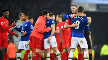 LIVERPOOL, ENGLAND - DECEMBER 19: Ross Barkley of Everton (8) and Jordan Henderson of Liverpool embrace after the Premier League match between Everton and Liverpool at Goodison Park on December 19, 2016 in Liverpool, England. (Photo by Michael Regan/Getty Images)