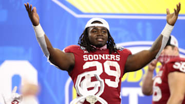 Dec 30, 2020; Arlington, TX, USA; Oklahoma Sooners running back Rhamondre Stevenson (29) reacts after receiving the offensive MVP awards after the game against the Florida Gators at ATT Stadium. Mandatory Credit: Tim Heitman-USA TODAY Sports
