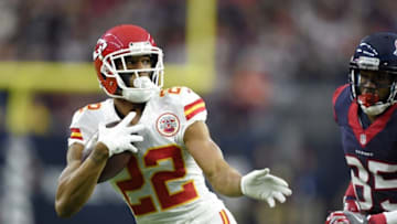 Jan 9, 2016; Houston, TX, USA; Kansas City Chiefs cornerback Marcus Peters (22) returns an interception against Houston Texans wide receiver Nate Washington (85) during the second quarter in a AFC Wild Card playoff football game at NRG Stadium. Mandatory Credit: John David Mercer-USA TODAY Sports