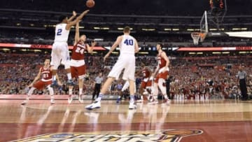 Apr 6, 2015; Indianapolis, IN, USA; Duke Blue Devils guard Quinn Cook (2) shoots a three-pointer against Wisconsin Badgers guard Bronson Koenig (24) in the first half in the 2015 NCAA Men