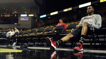 Dec 31, 2013; Orlando, FL, USA; Louisville Cardinals guard Kevin Ware (5) sits courtside before the Louisville Cardinals faces the UCF Knights at UCF Arena. Mandatory Credit: David Manning-USA TODAY Sports