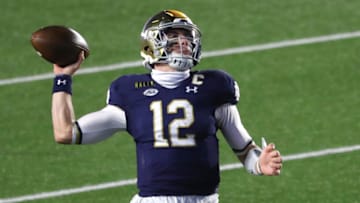 CHESTNUT HILL, MASSACHUSETTS - NOVEMBER 14: Ian Book #12 of the Notre Dame Fighting Irish makes a pass against the Boston College Eagles at Alumni Stadium on November 14, 2020 in Chestnut Hill, Massachusetts. (Photo by Maddie Meyer/Getty Images)